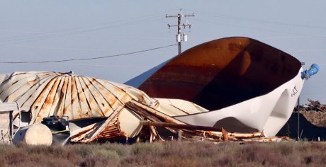 The city's water tank debris the day after the 1.5 million gallon tank exploded, killing a contractor working on the tank.